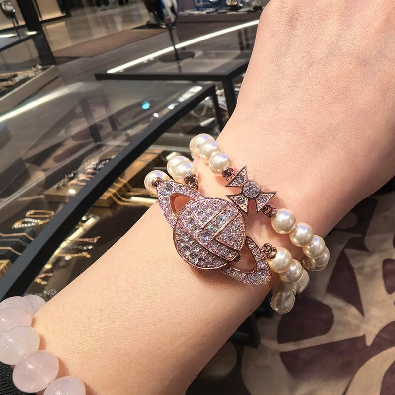 Pearl-set diamond style Saturn watch