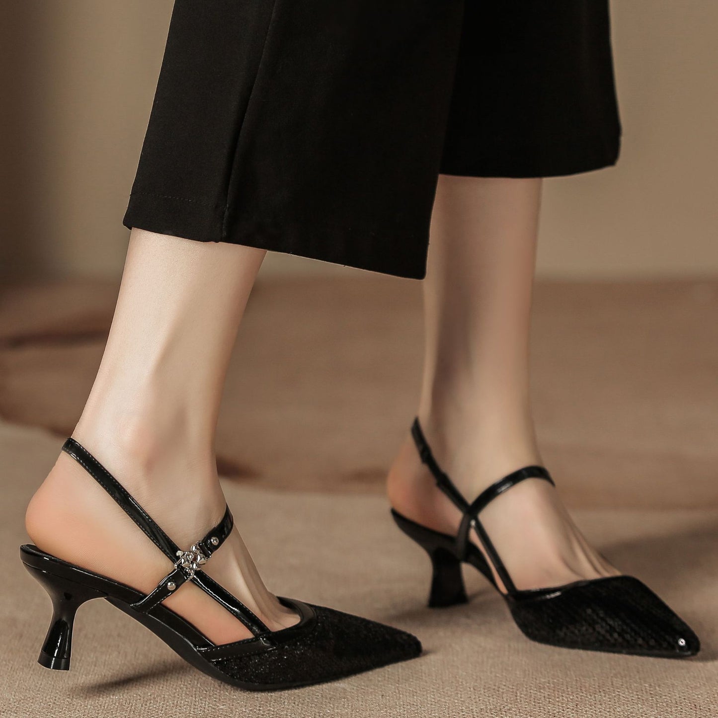 Pointed-toe low-heeled women's shoes with small X-shaped embellishments on the sole