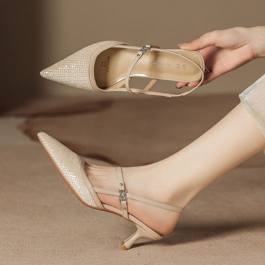 Pointed-toe low-heeled women's shoes with small X-shaped embellishments on the sole